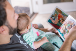 A father reading a story to his toddler son