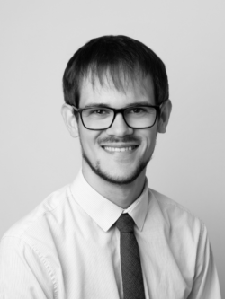 black and white image of man in shirt and tie