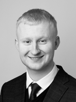 black and white image of man in suit