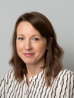 Women dressed in smart striped shirt