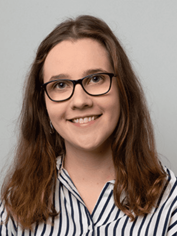 Headshot of a young woman with glasses wearing a striped shirt, representing East Midlands solicitors