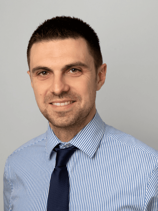 Portrait of a male solicitor in a striped shirt and tie, representing Ellis-Fermor & Negus solicitors in the East Midlands.