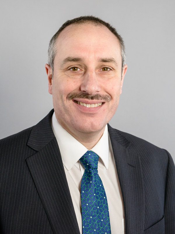 Smiling solicitor in a formal suit, representing Ellis-Fermor & Negus, a solicitors’ firm in the East Midlands.