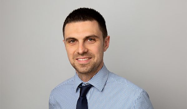 A professional solicitor from Ellis-Fermor & Negus in a striped shirt and tie, representing approachable legal advice in the East Midlands.