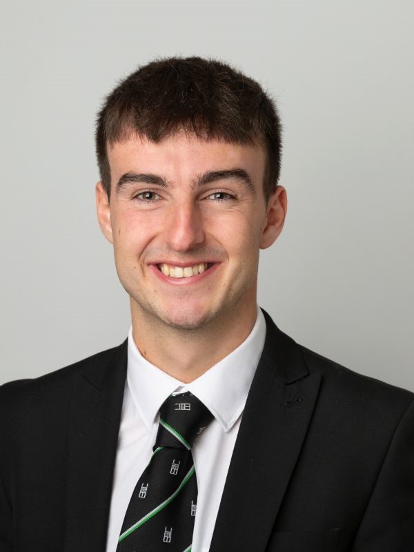 Smiling male solicitor in a black suit and tie, representing Ellis-Fermor & Negus in the East Midlands