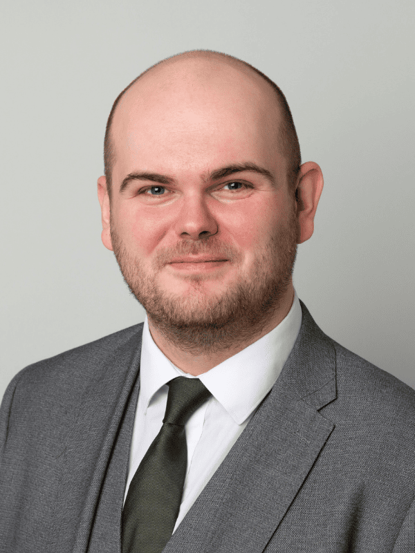 Headshot of a male solicitor in a gray suit and tie, representing Ellis-Fermor & Negus, East Midlands legal firm.