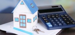 This image is of a house, keys and calculator. representing the lifetime gift (house etc) and calculating whether there could be hidden inheritance tax liabilities.